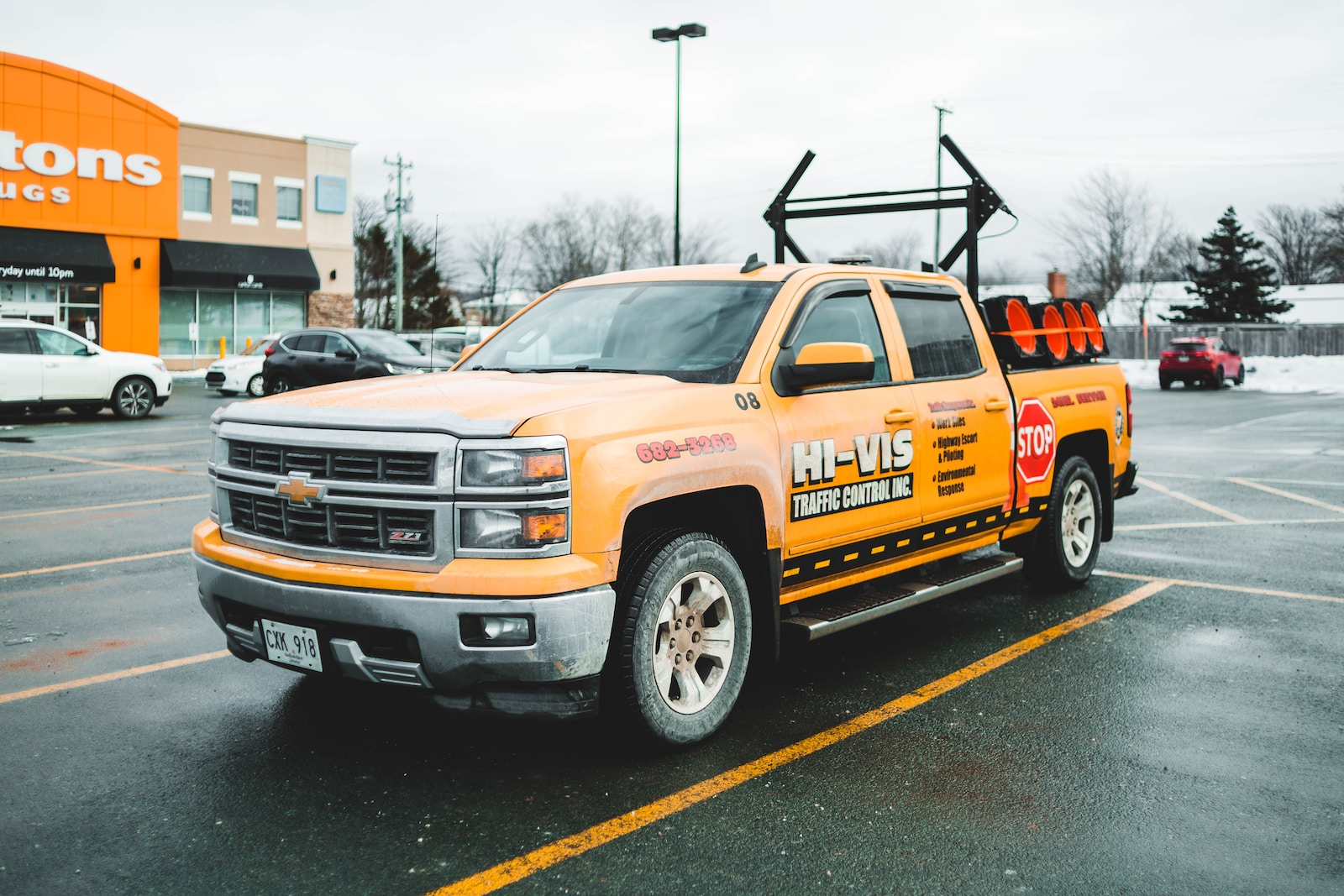 orange chevrolet truck on road during daytime