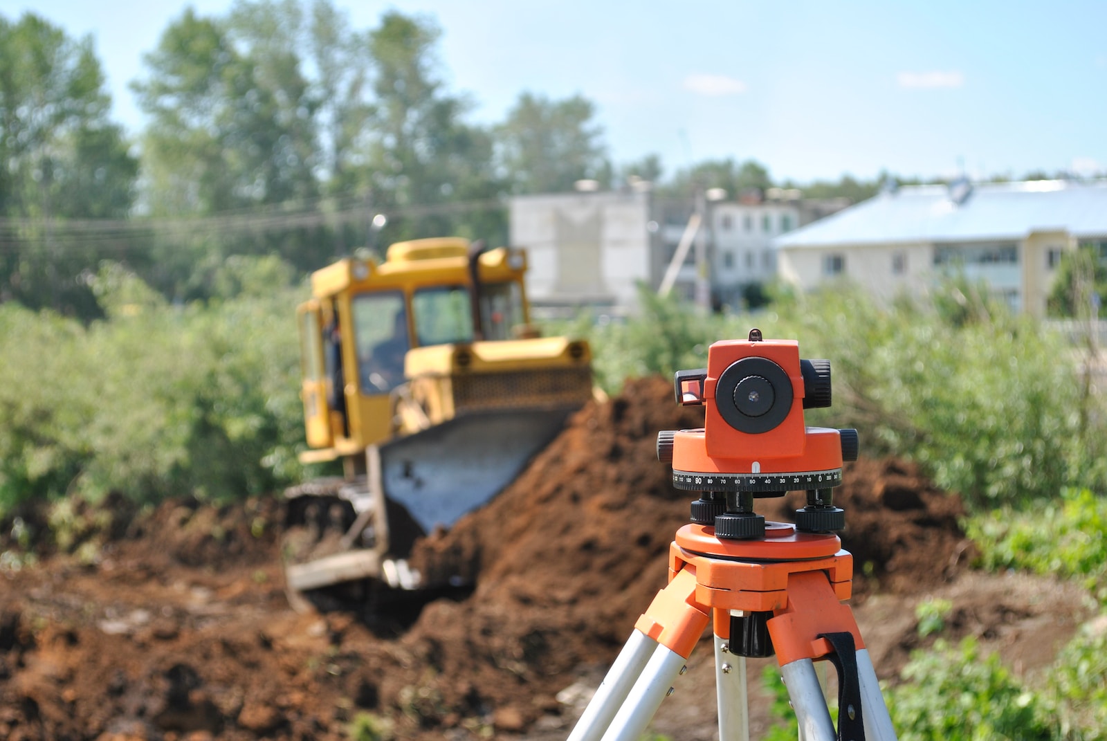 a construction site with a camera on a tripod